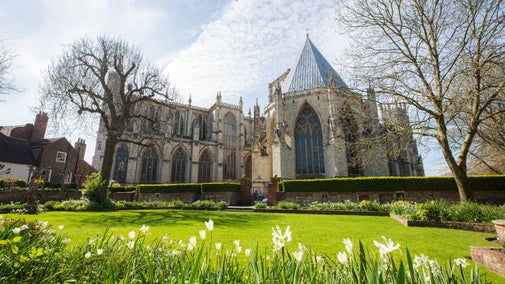 Side view of York Minster across the garden of Treasurer's House